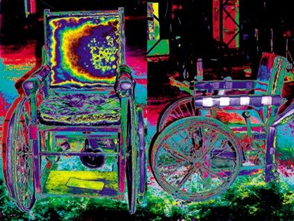 Ju Gosling, Wheels on Fire &mdash; Two solarized photographs of the same antique wicker wheelchair, front view and side view, in electric magenta, green and yellow, the chair nearly dissolving into an equally saturated background.